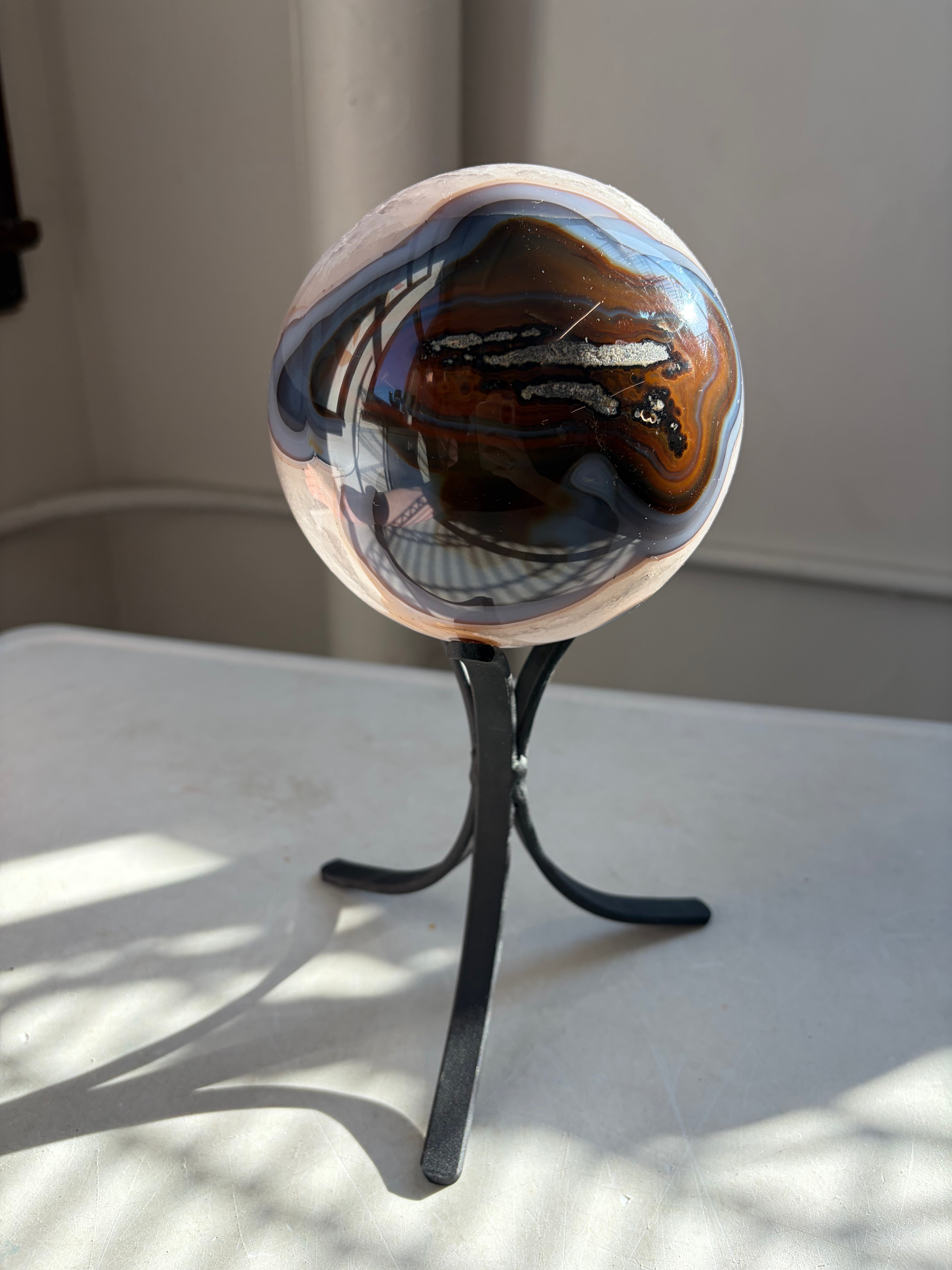 reverse side of agate sphere on stand