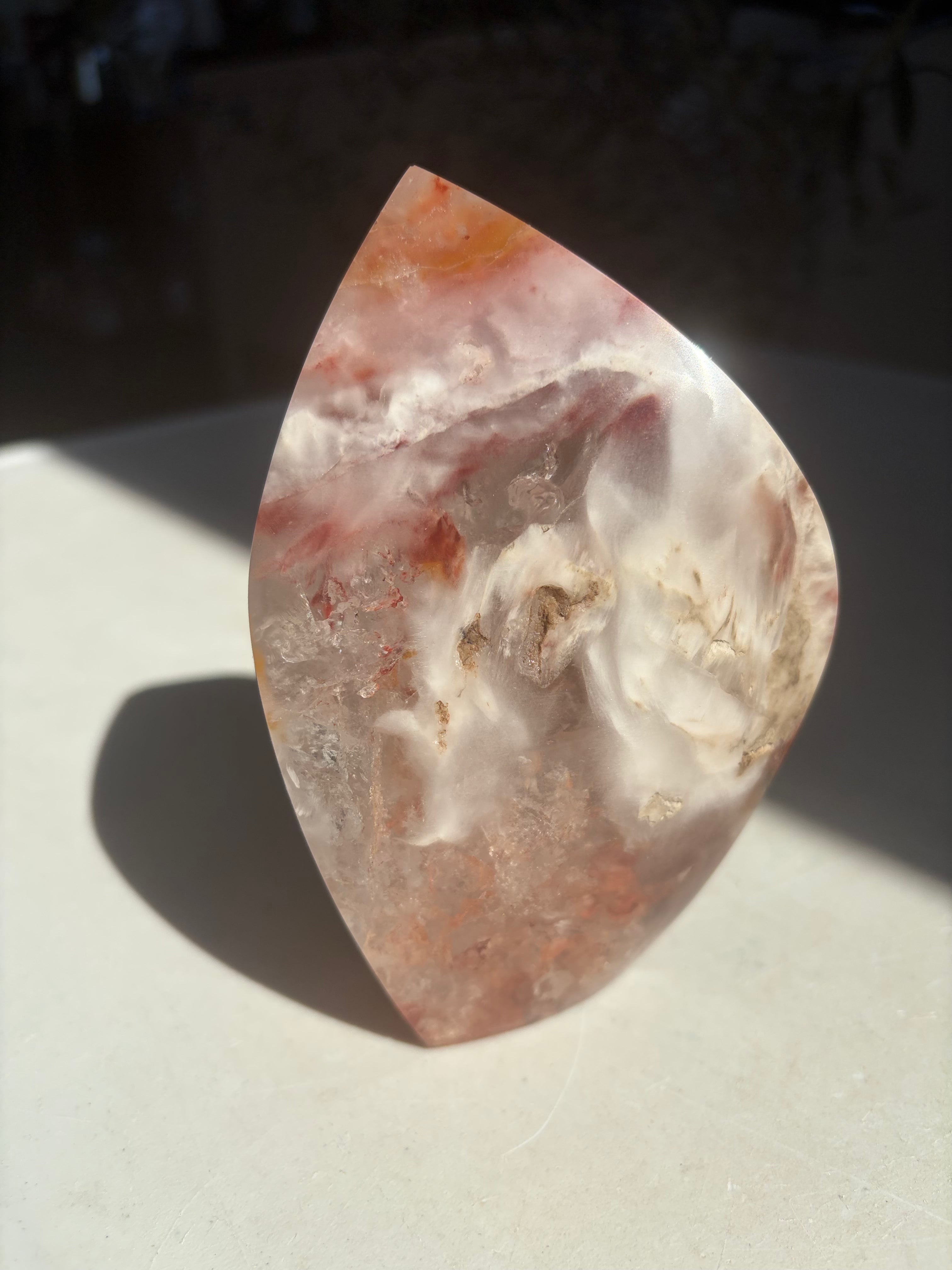 polished amphibole quartz on marble counter in sunlight