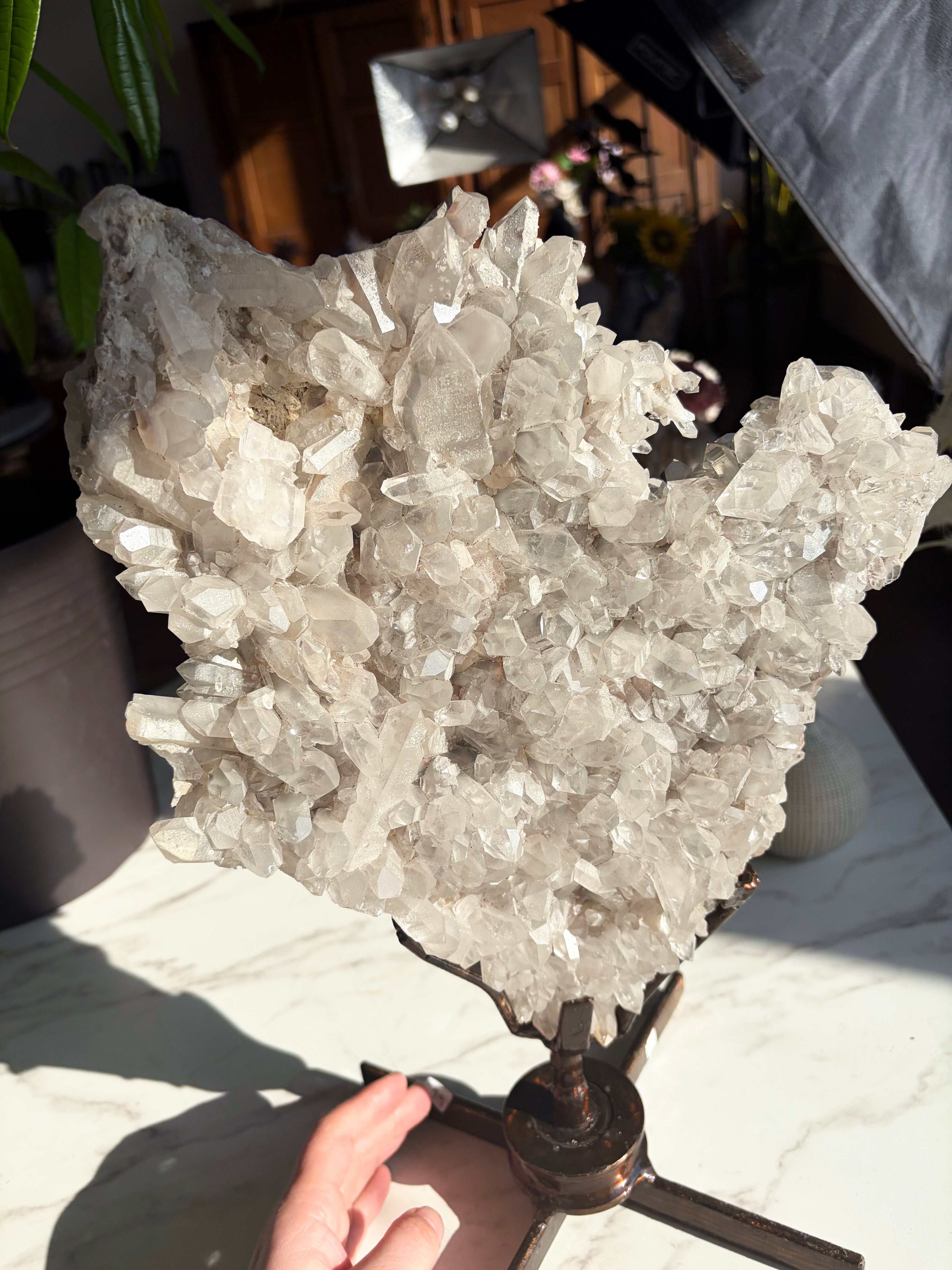 quartz specimen on a custom rotating stand