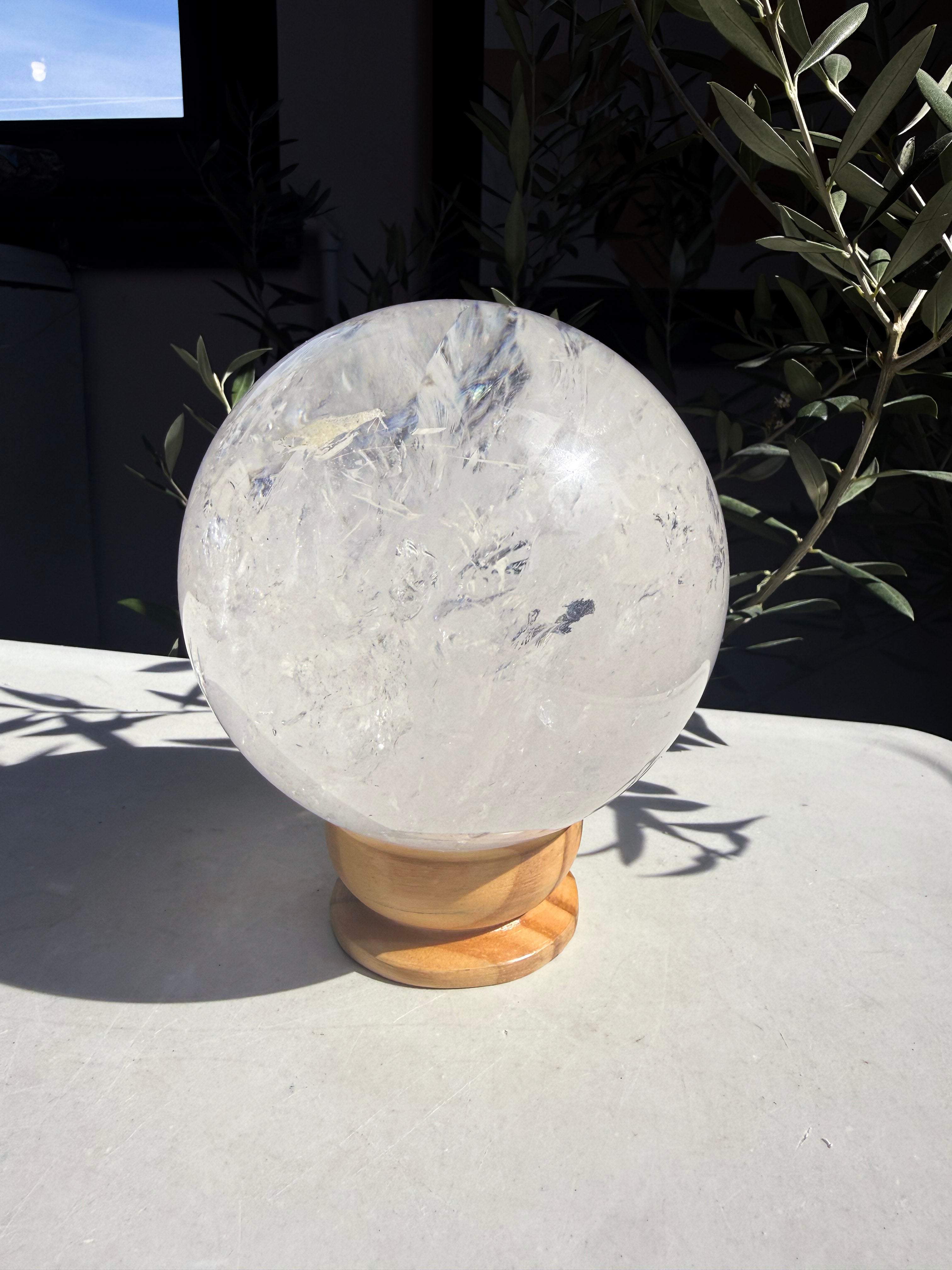 Giant Brazilian Quartz globe on wooden stand