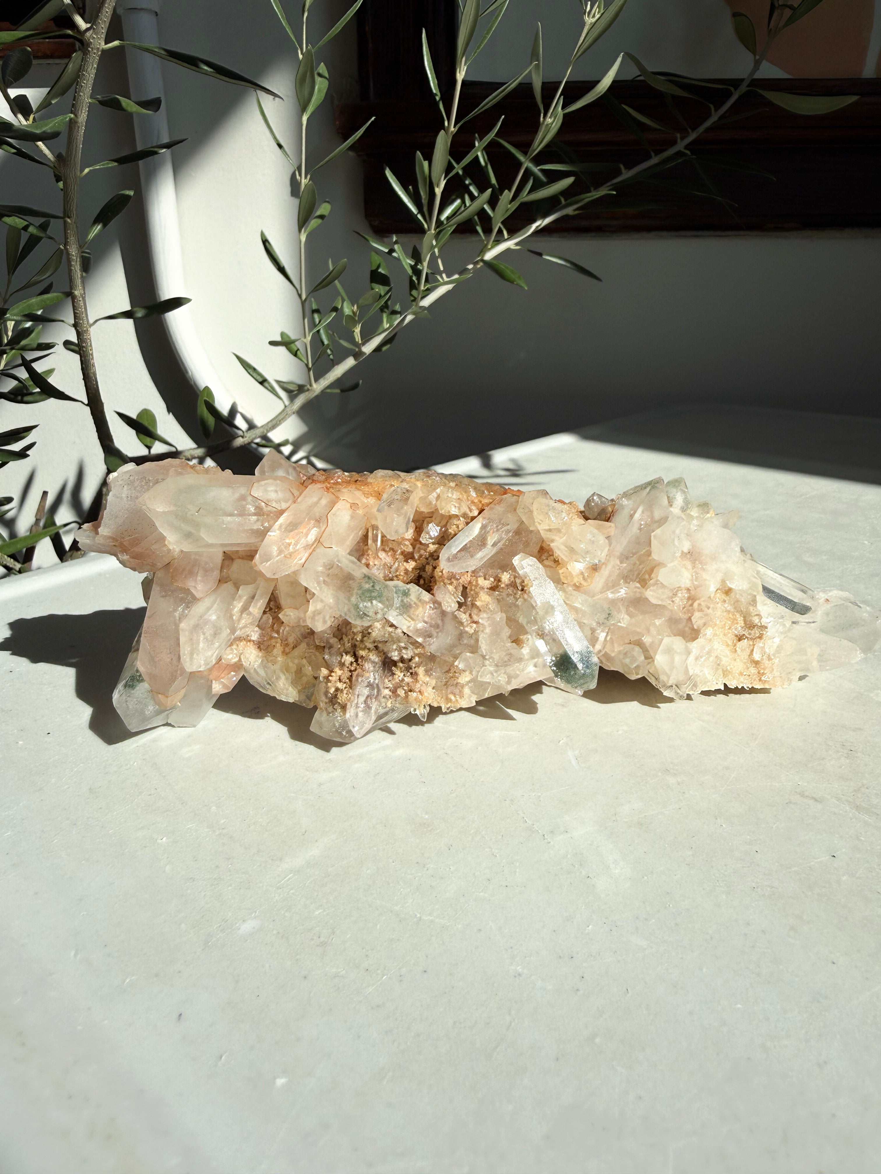 Chlorite and iron inclusions quartz on white marble counter