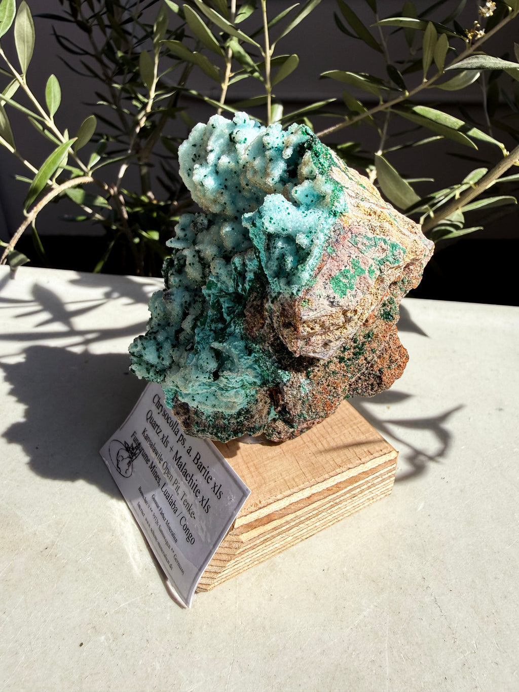 Chrysocolla, Barite, Quartz, Malachite mounted on a wooden base