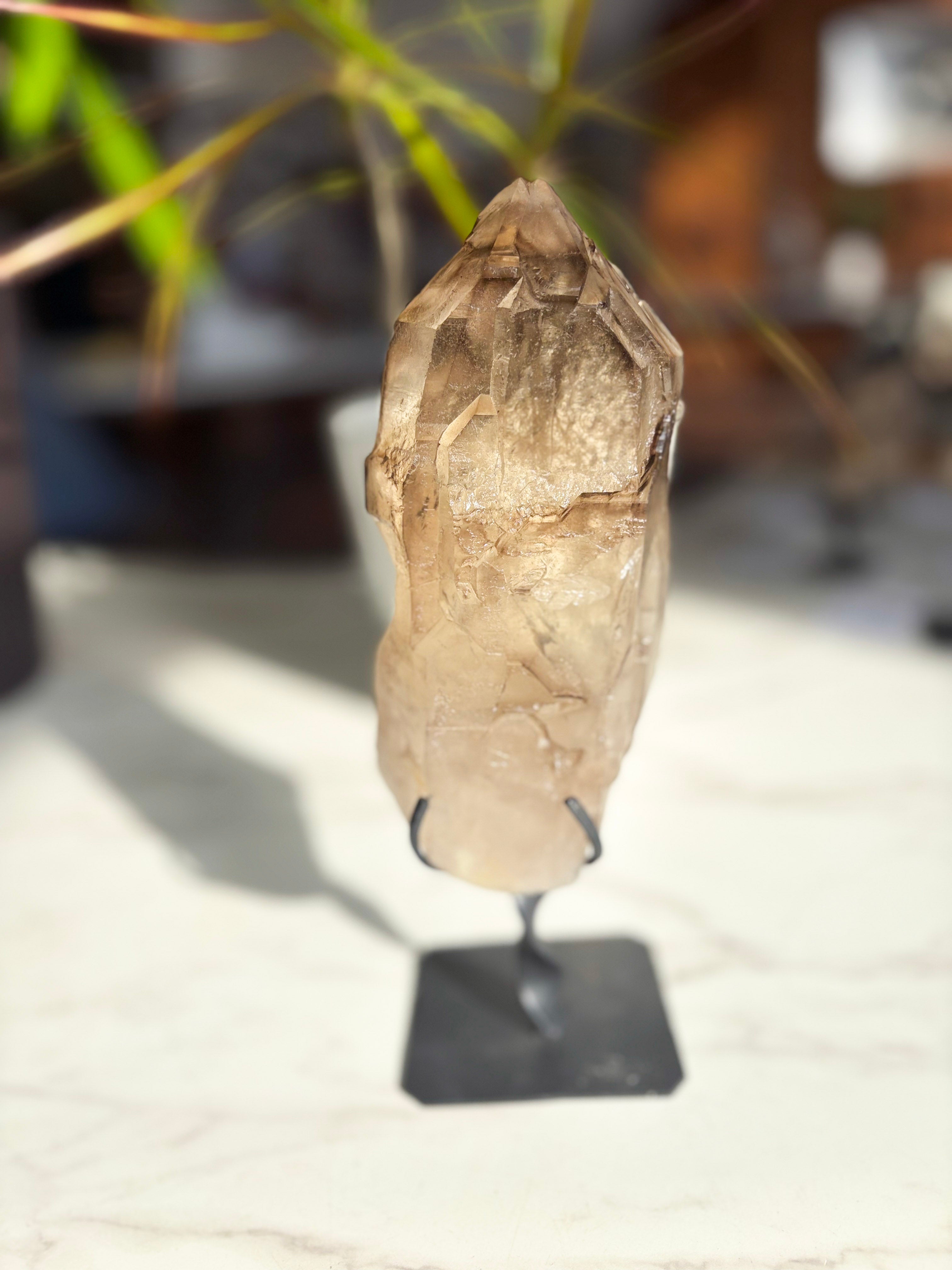 Elestial smokey Citrine on Custom Stand over white counter