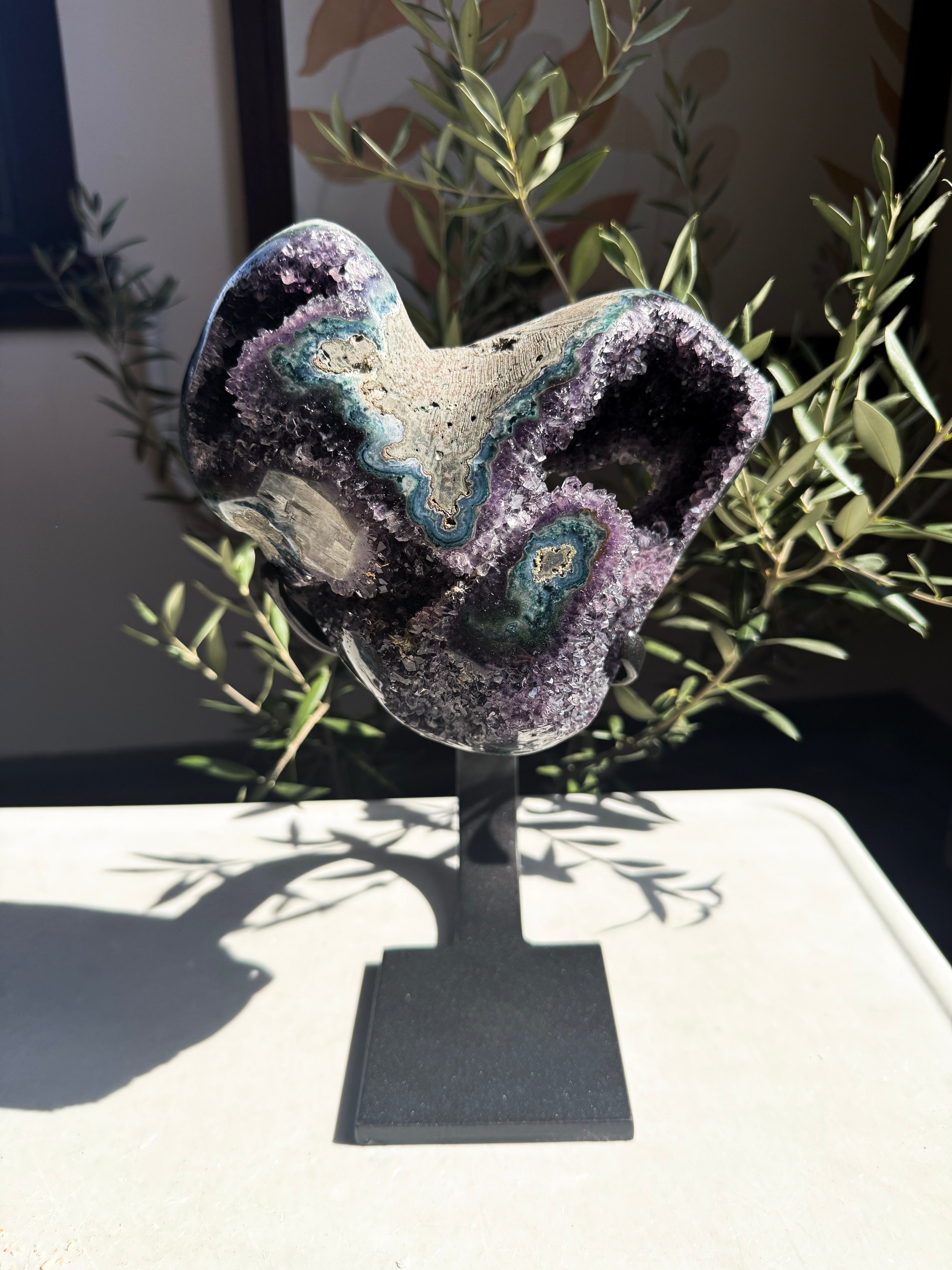 Organic heart-shaped amethyst portal statement piece on custom base