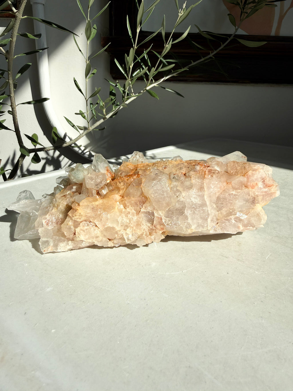Chlorite Quartz Cluster with iron inclusions on marble counter