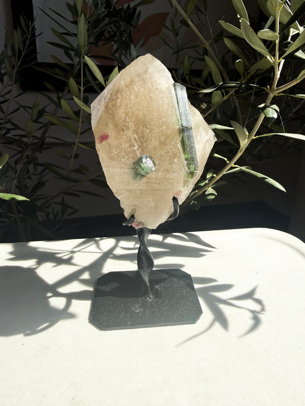 Unique blue tourmaline on a natural citrine matrix on a custom stand