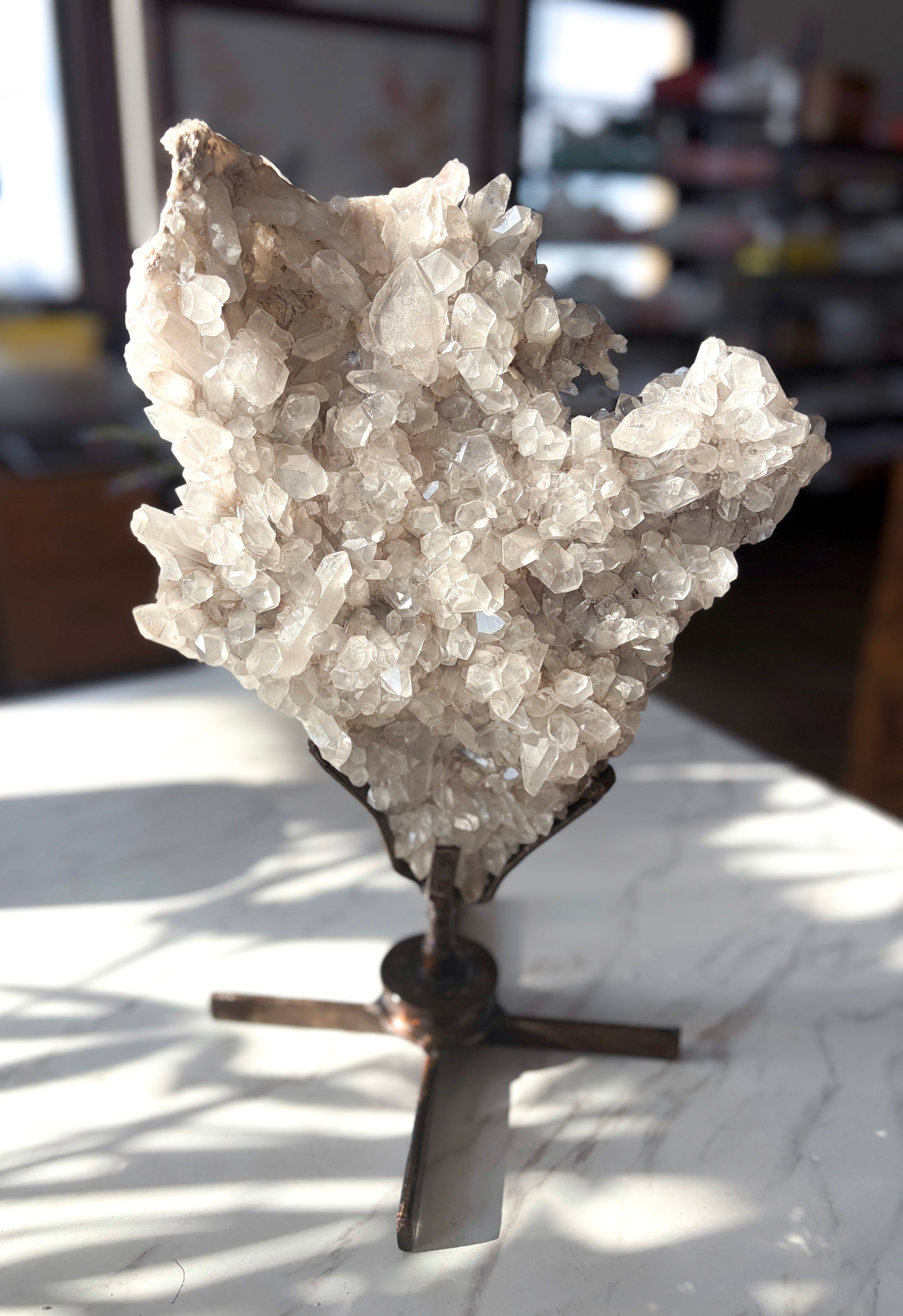 double-sided quartz specimen presented on a custom rotating stand