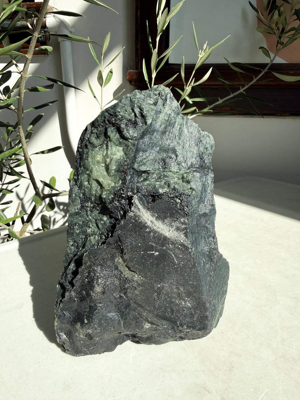 green emerald freeform on marble counter