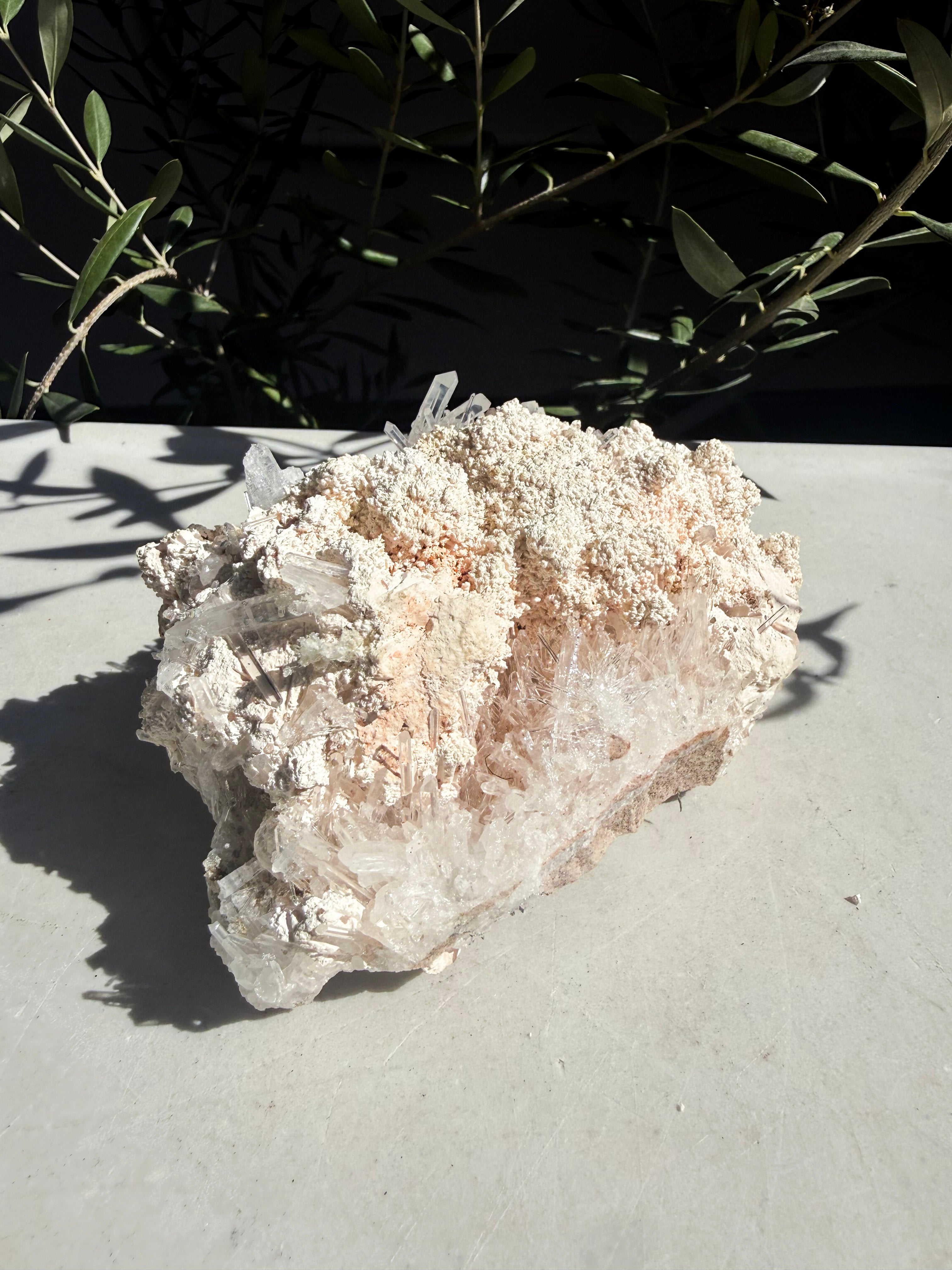 colombian needle quartz with calcite on white marble counter