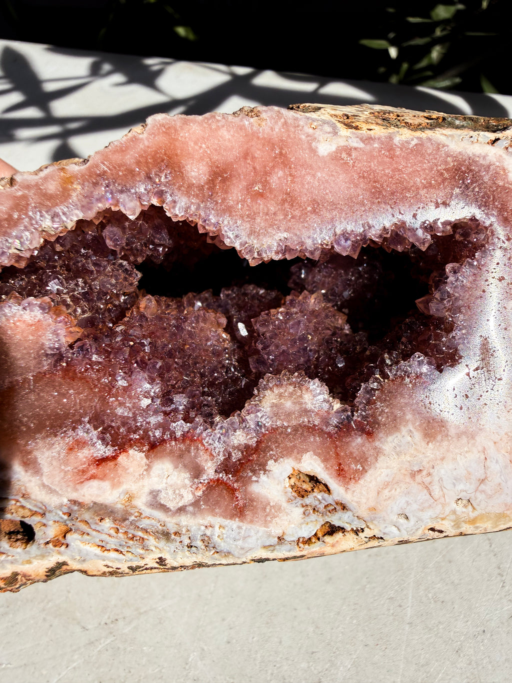 close up of pink amethyst with crystal druzy center