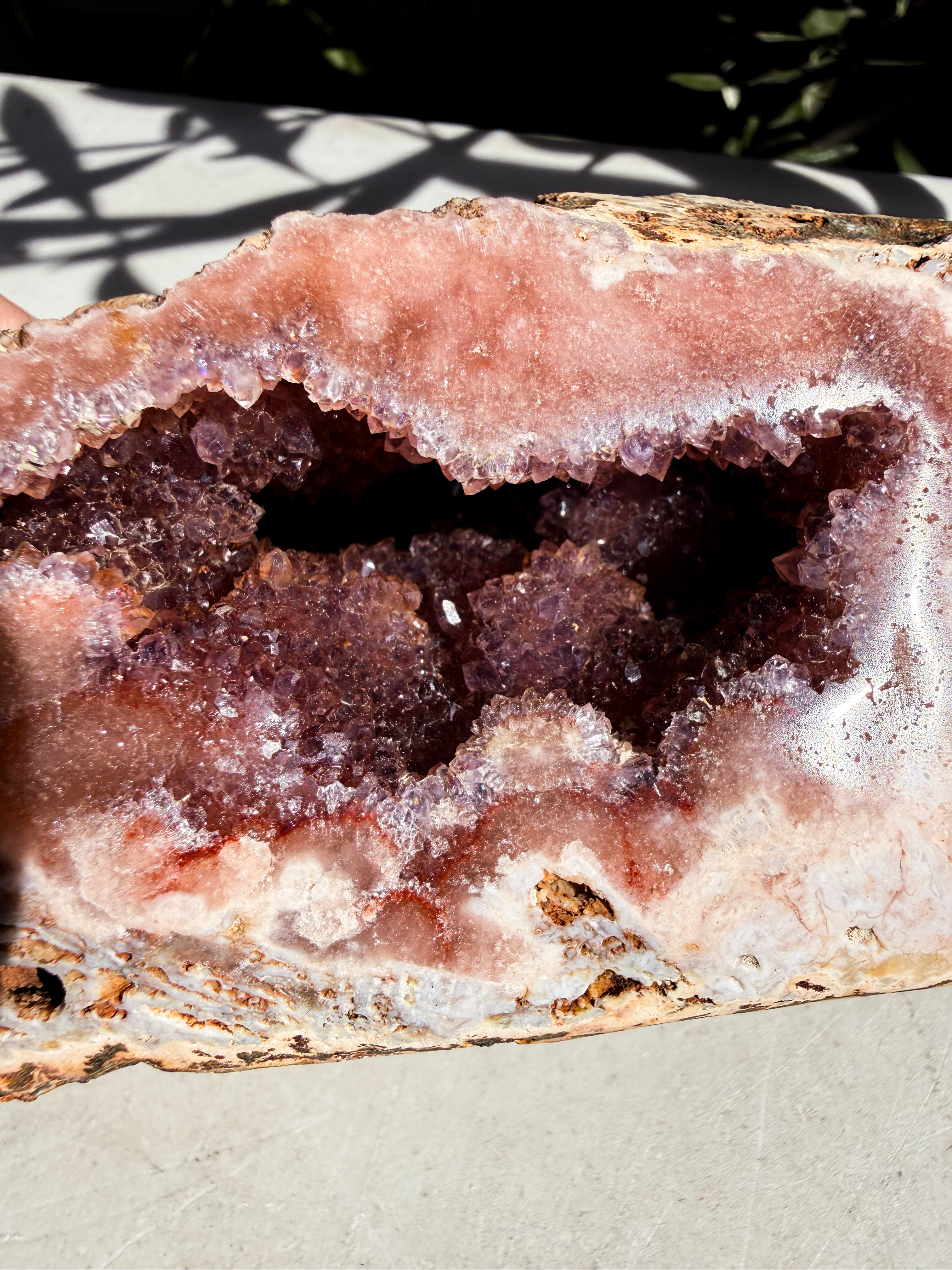 close up of pink amethyst with crystal druzy center