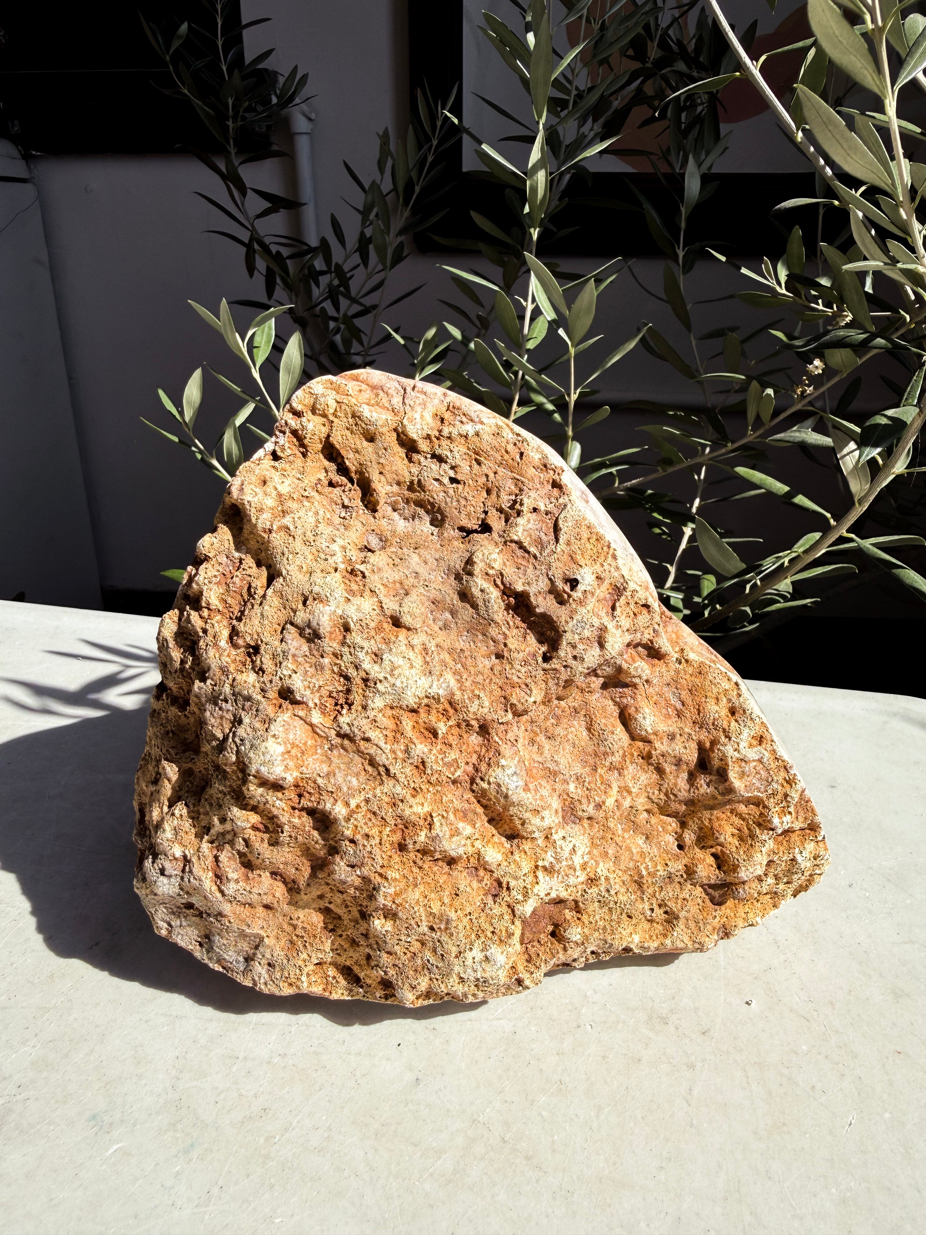 raw amethyst back face on white marble counter