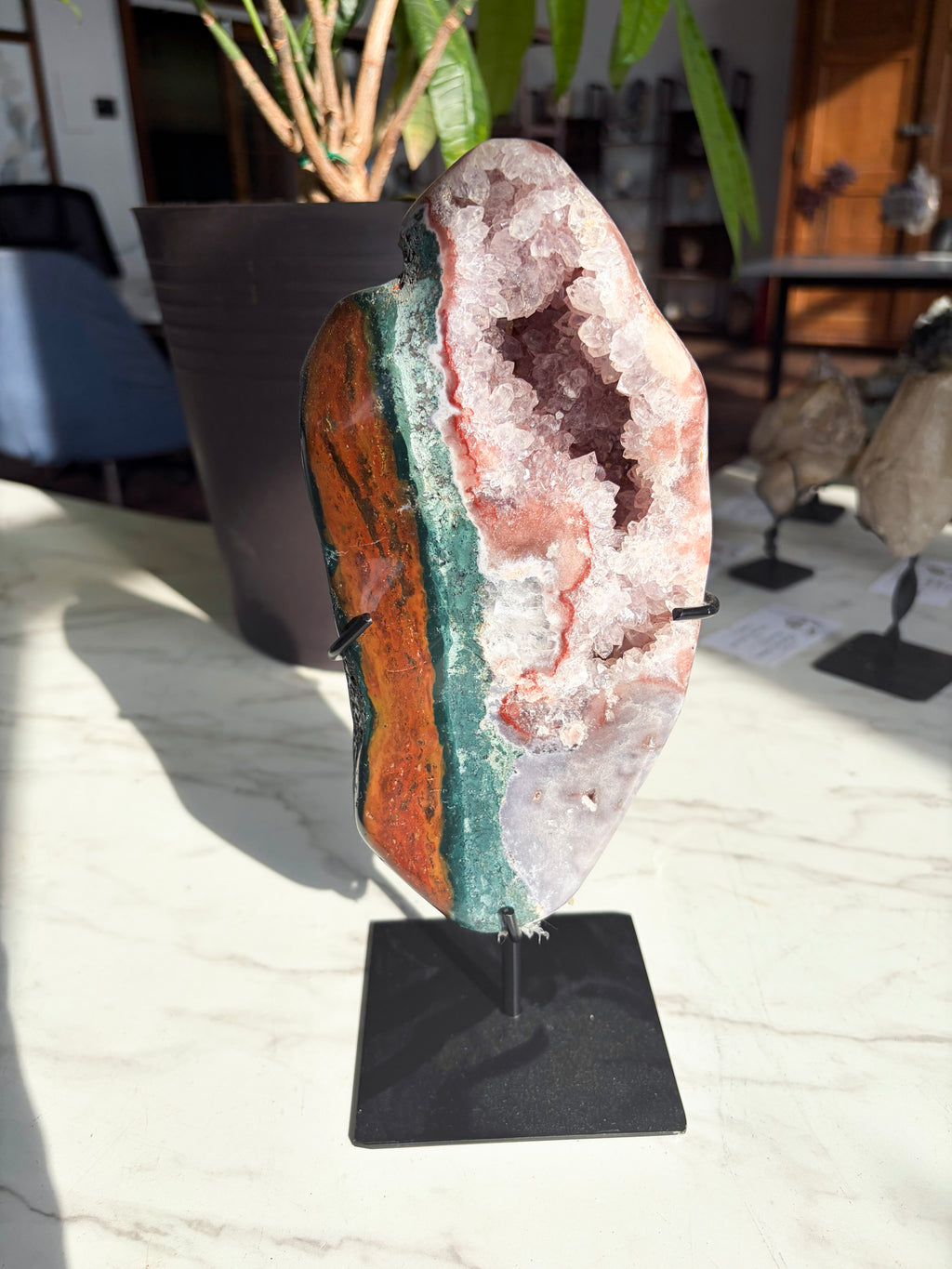 pink amethyst with vibrant red and green jasper with druzy crystals on stand