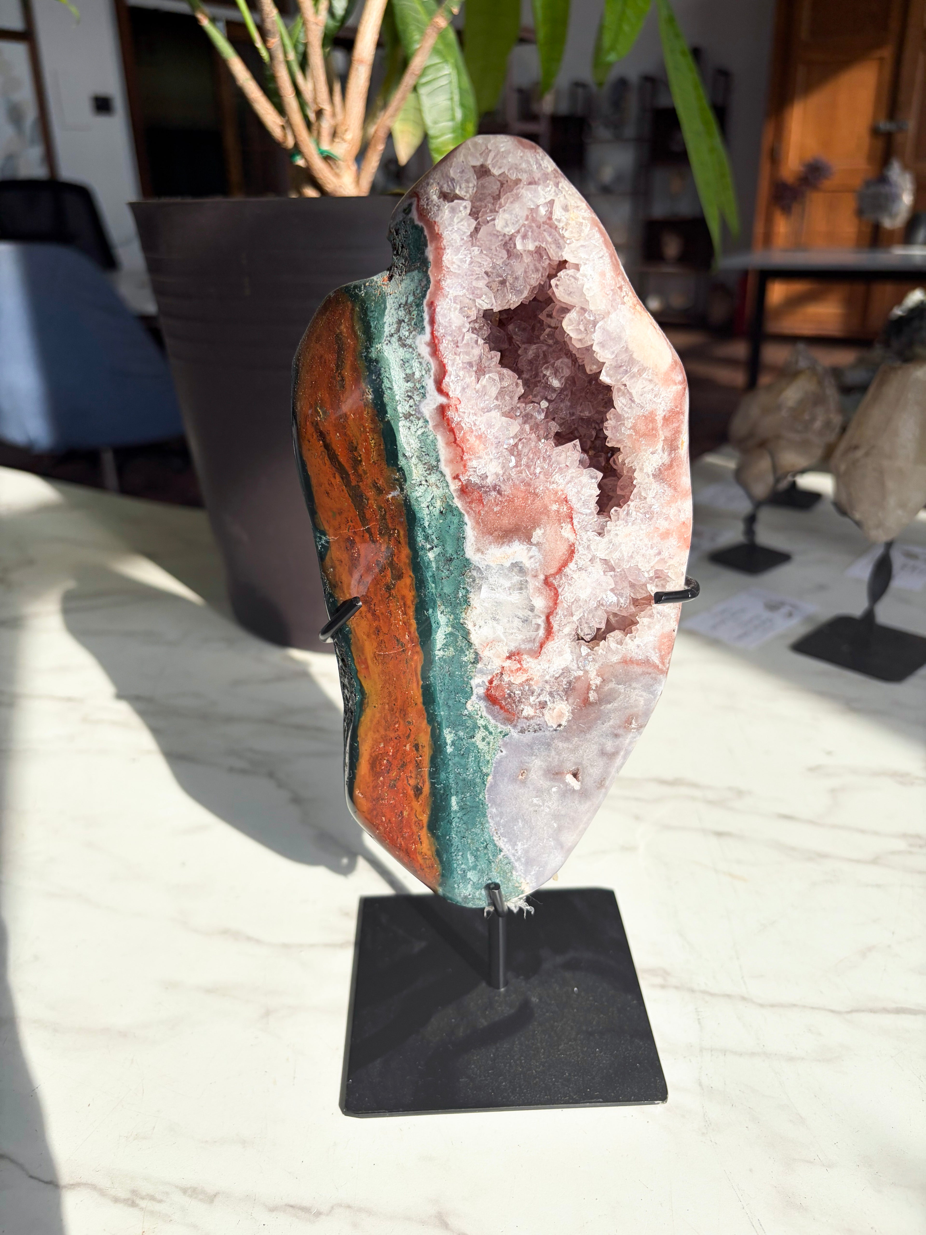 pink amethyst with vibrant red and green jasper with druzy crystals on stand