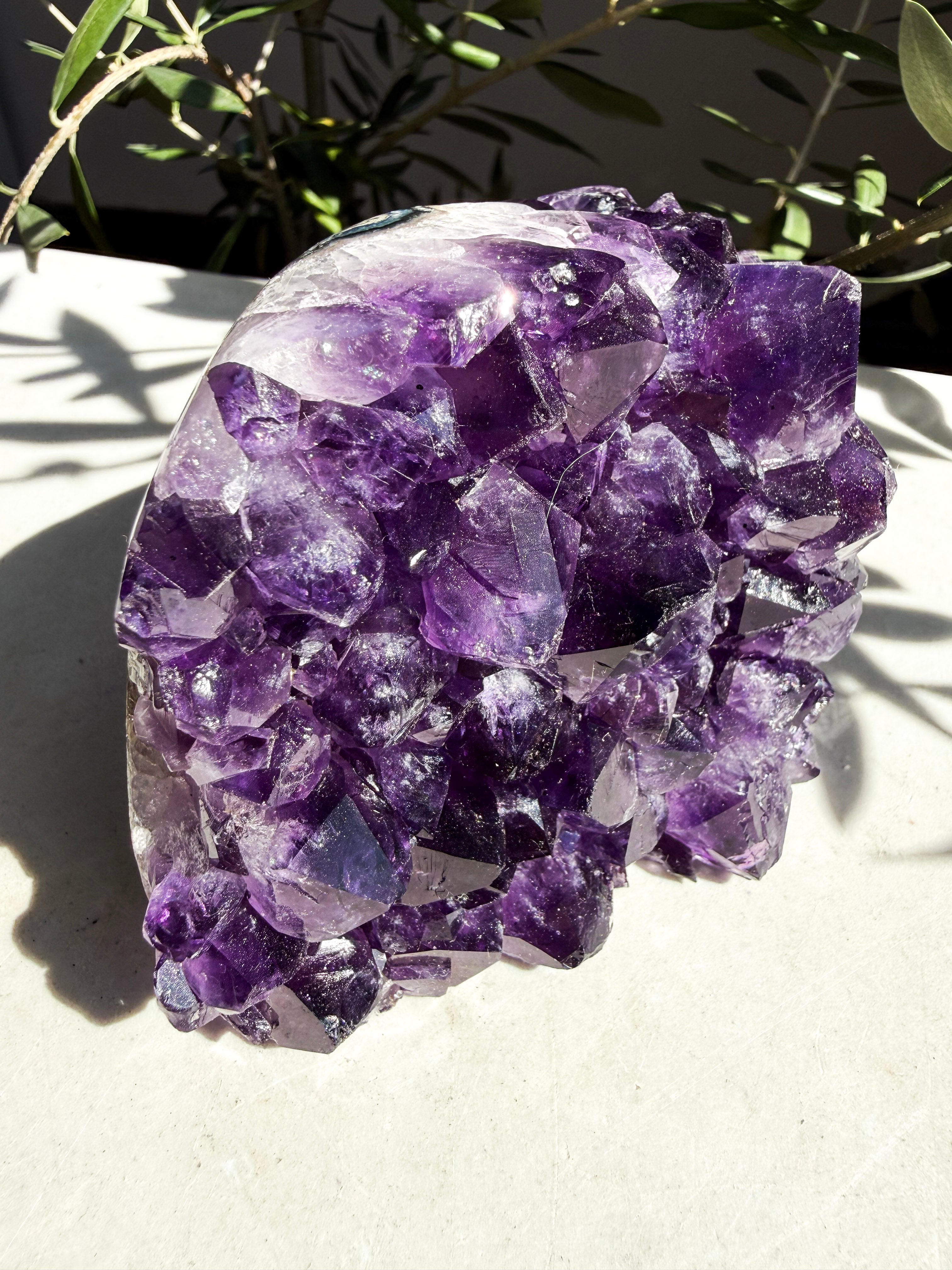 Close up of uruguaian grape purple amethyst on marble countertop