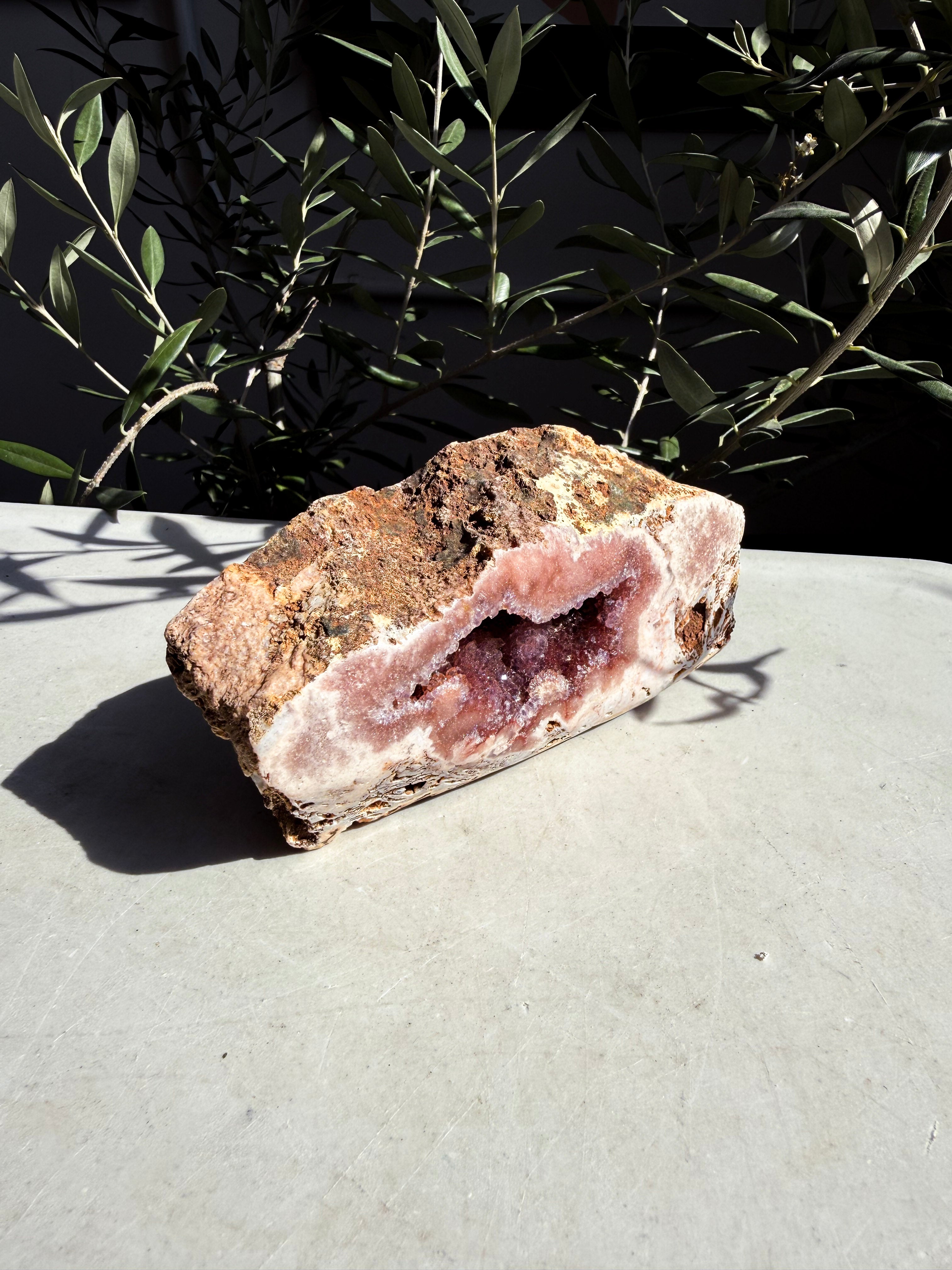 angeled Pink Amethyst Freeform with druzy center on counter