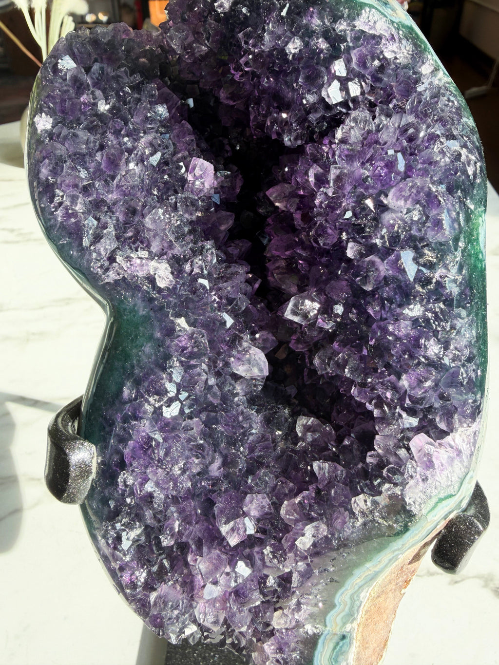 close up of amethyst mineral with polished green agate