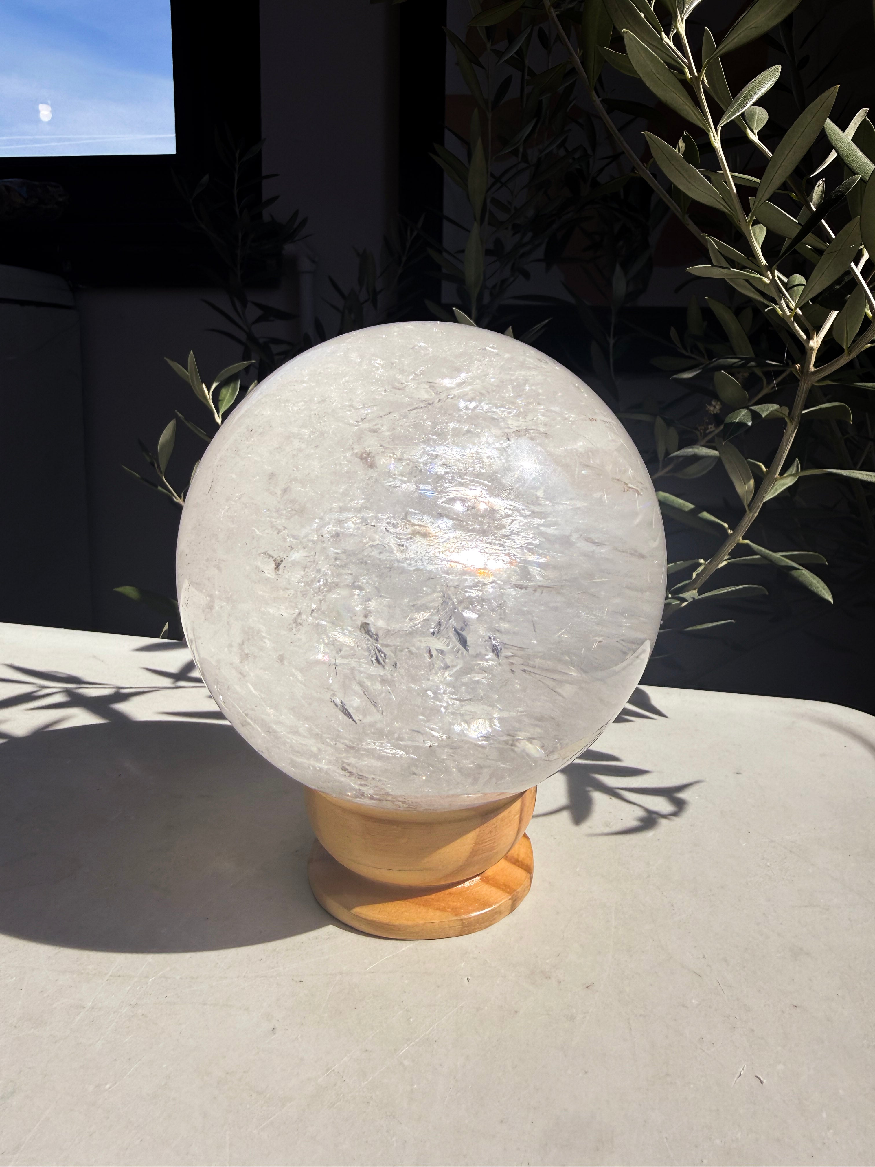 quartz crystal ball on marble countertop