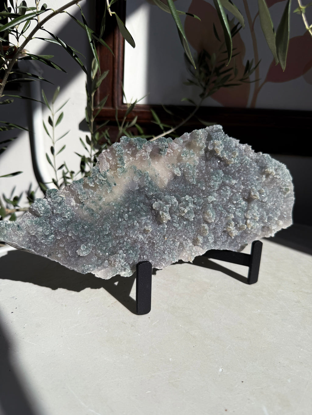 sparkly and bubbly emerald green amethyst flower plate on metal stand. 