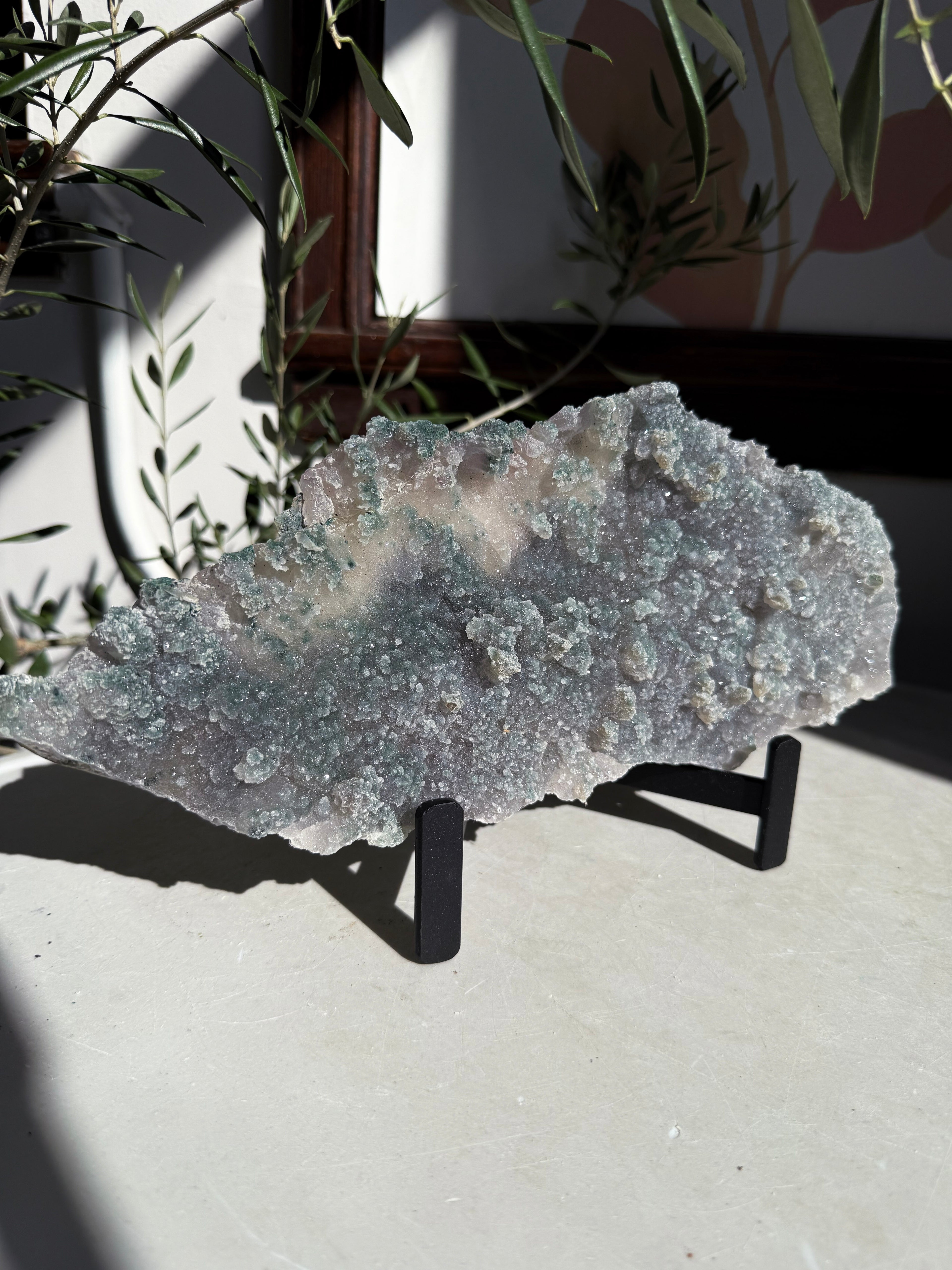 sparkly and bubbly emerald green amethyst flower plate on metal stand. 