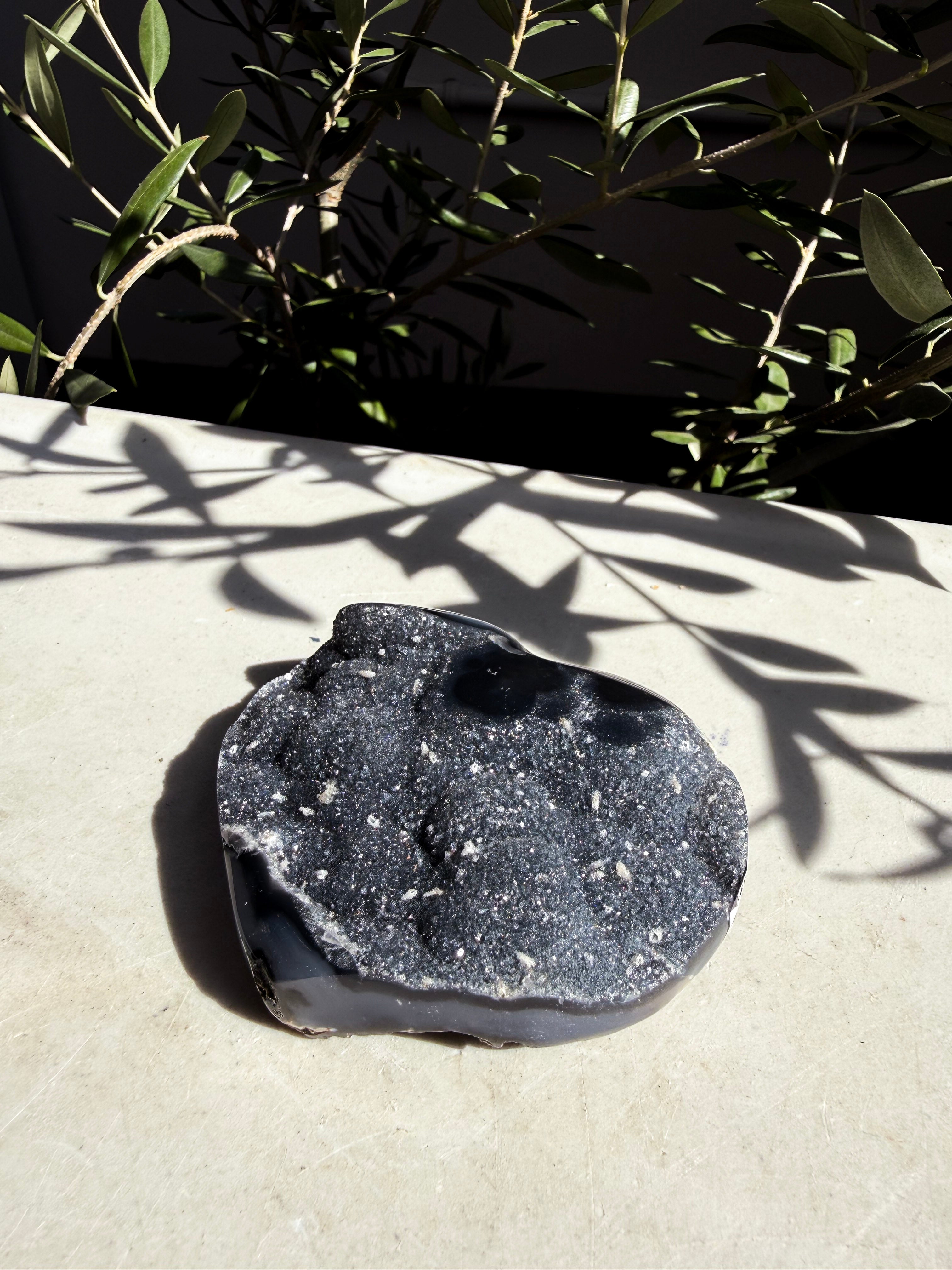 raw agate navy heart on white marble background