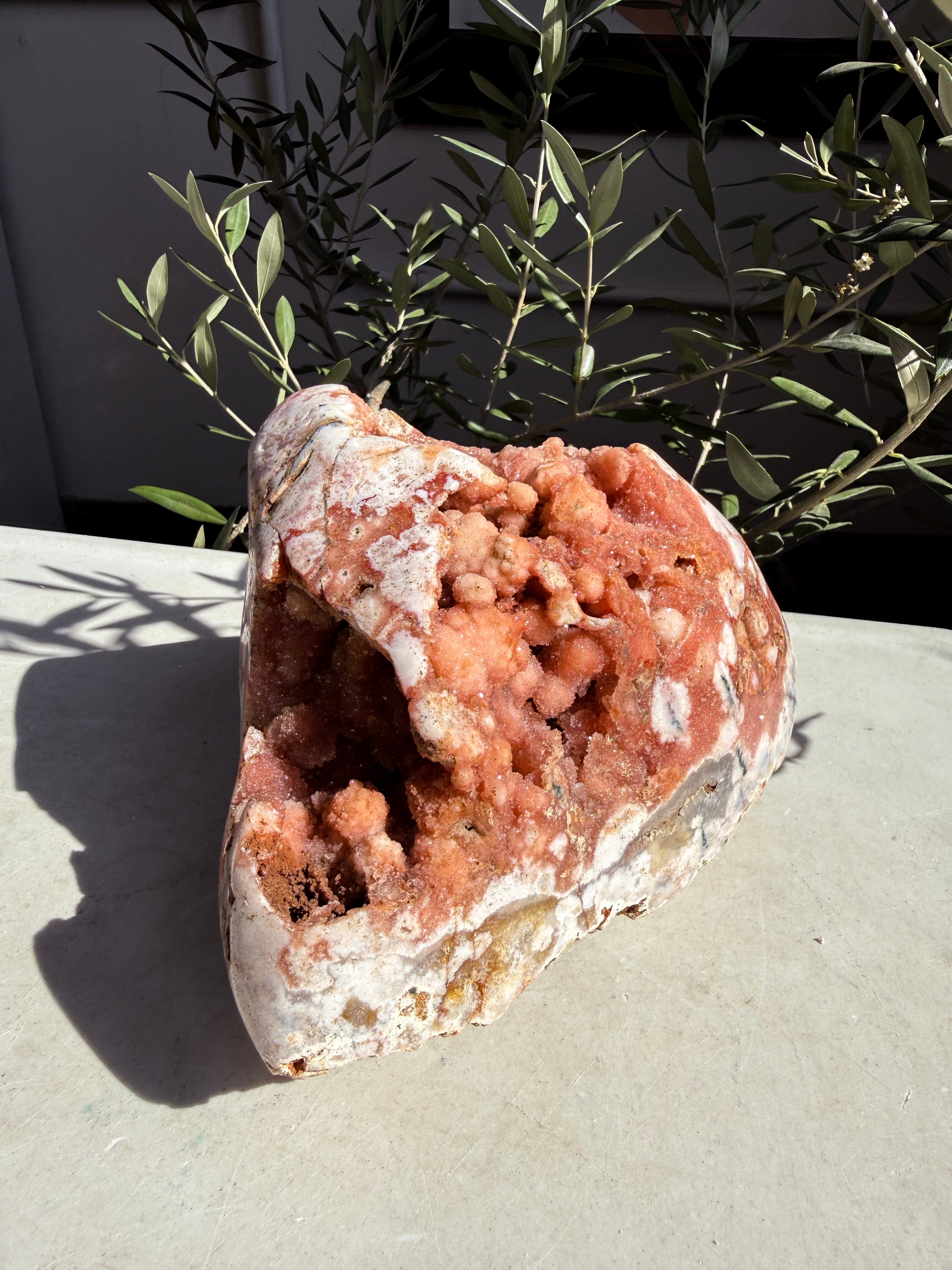 bright pink amethyst with botryoidal druzy  on countertop