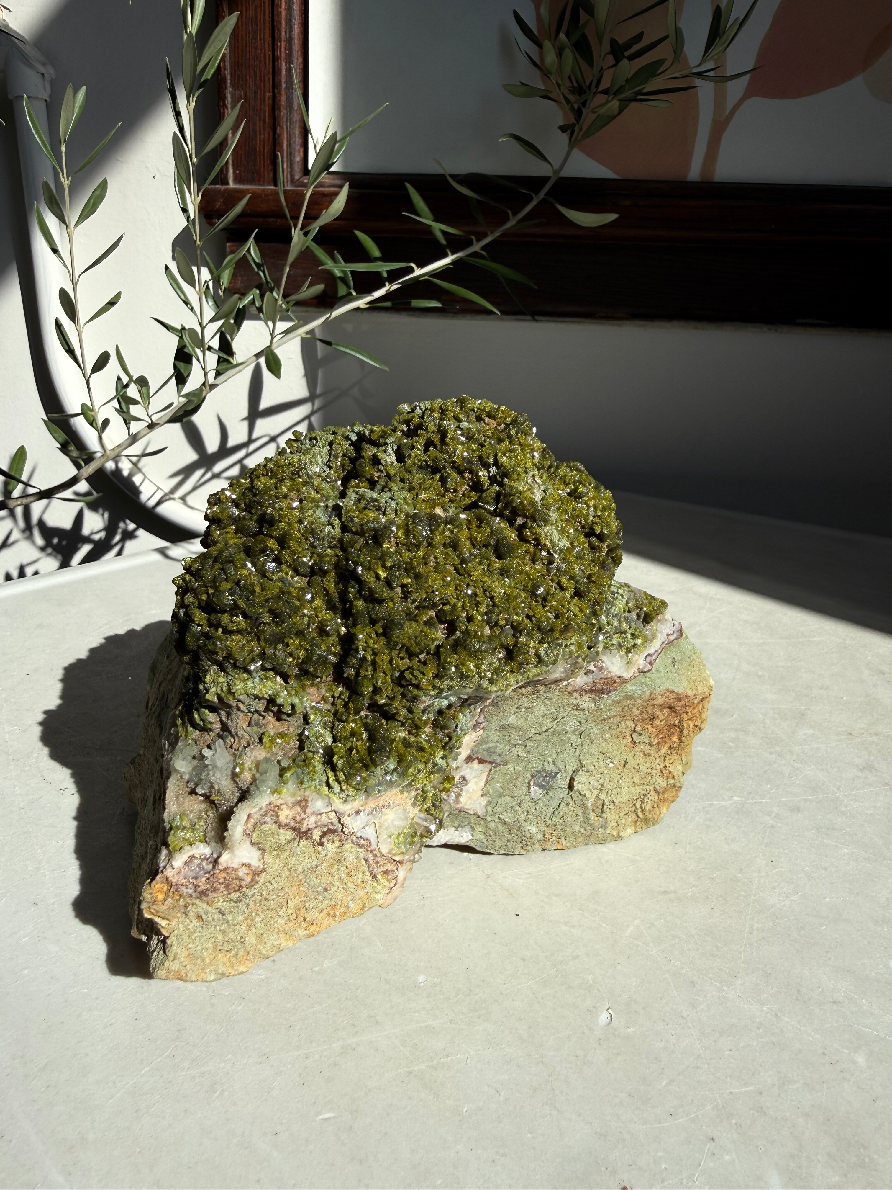 large epidote and quartz on marble countertop